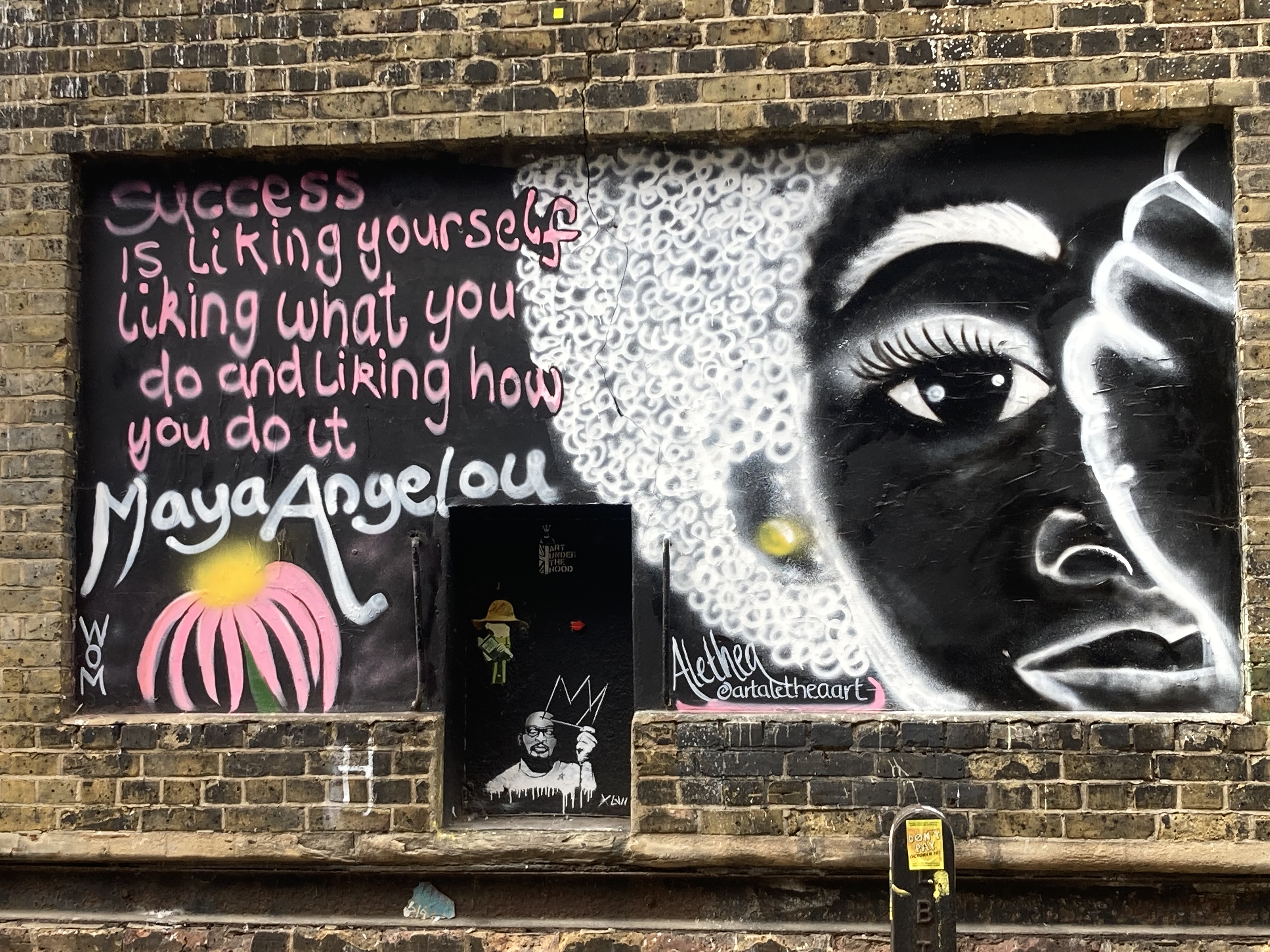 A wall in London's East End with street art